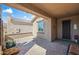 A covered patio with brick flooring that offers an outdoor living space and a view at 26336 W Tina Ln, Buckeye, AZ 85396