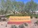 Sun City Festival Pet Park sign with desert landscaping and mature trees offers community recreation at 26336 W Tina Ln, Buckeye, AZ 85396