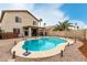 Spacious backyard with private pool, desert landscape, covered patio, and an inviting outdoor living area at 31527 N Sundown N Dr, San Tan Valley, AZ 85143
