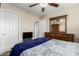 Comfortable bedroom featuring a ceiling fan and traditional furniture, including a dresser with mirror at 31527 N Sundown N Dr, San Tan Valley, AZ 85143