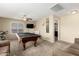 Spacious game room featuring a pool table, ceiling fan, TV, and comfortable seating area at 31527 N Sundown N Dr, San Tan Valley, AZ 85143