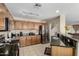Kitchen features stainless appliances, granite countertops, tile floors, and wooden cabinets at 31527 N Sundown N Dr, San Tan Valley, AZ 85143