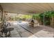 Spacious covered back patio with a built-in pizza oven, perfect for outdoor entertaining and relaxation at 3224 W Ironwood Dr, Phoenix, AZ 85051