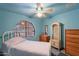 Inviting bedroom featuring arched window, neutral color scheme, and ample storage at 3224 W Ironwood Dr, Phoenix, AZ 85051