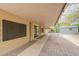 Extended covered patio with brick pavers, leading to a backyard area featuring a storage shed at 3224 W Ironwood Dr, Phoenix, AZ 85051