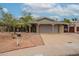 Charming single-story home featuring a covered carport, well-maintained landscaping, and a welcoming brick pathway at 3224 W Ironwood Dr, Phoenix, AZ 85051