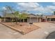 Single-story home featuring a covered carport, easy to maintain landscaping, and a welcoming brick pathway at 3224 W Ironwood Dr, Phoenix, AZ 85051