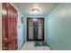 Inviting foyer featuring a tile floor, decorative front door with wreaths, and serene light-blue walls at 3224 W Ironwood Dr, Phoenix, AZ 85051