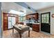 View of the kitchen with cherry cabinets, a butcher block island, and a skylight at 3224 W Ironwood Dr, Phoenix, AZ 85051