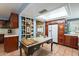 Spacious kitchen with dark cabinetry, unique island, open shelving and lots of natural light at 3224 W Ironwood Dr, Phoenix, AZ 85051