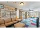 Bright living room with large windows, doors to the patio, and cozy couches at 3224 W Ironwood Dr, Phoenix, AZ 85051