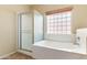 Bathroom with a tub and separate shower at 3253 N 138Th Ave, Avondale, AZ 85392
