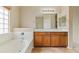 Bathroom with double sinks and a tub at 3253 N 138Th Ave, Avondale, AZ 85392