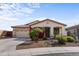 Charming single-story home features a two-car garage and desert landscaping at 3253 N 138Th Ave, Avondale, AZ 85392