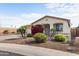 Single-story home boasts desert landscaping, a two-car garage, and a welcoming front porch at 3253 N 138Th Ave, Avondale, AZ 85392