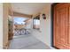 Inviting front porch with decorative railing and a solid wood front door at 3253 N 138Th Ave, Avondale, AZ 85392
