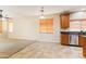 Open living room with tile and carpet flooring and bright natural light at 3253 N 138Th Ave, Avondale, AZ 85392