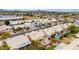 Neighborhood featuring various homes with well-maintained backyards, lush greenery, and community amenities in the distance at 3348 E Sequoia Dr, Phoenix, AZ 85050
