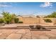A hardscaped backyard with beautiful stone pavers, low block wall and mature landscaping at 3348 E Sequoia Dr, Phoenix, AZ 85050