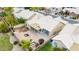 An aerial view of a backyard featuring a stone patio, small grass area, and block wall fence at 3348 E Sequoia Dr, Phoenix, AZ 85050