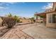 This backyard has stone pavers, concrete patio, and a covered area with landscaping at 3348 E Sequoia Dr, Phoenix, AZ 85050