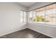 Bright room featuring wood floors, neutral walls, and natural light from the windows at 3348 E Sequoia Dr, Phoenix, AZ 85050