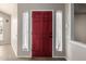Welcoming foyer with a striking red door and sidelight windows at 3348 E Sequoia Dr, Phoenix, AZ 85050