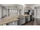 Open-concept kitchen featuring stainless appliances and an island with granite counters at 3348 E Sequoia Dr, Phoenix, AZ 85050