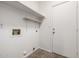 A simple laundry room features shelving and a hookup for a washing machine at 3348 E Sequoia Dr, Phoenix, AZ 85050