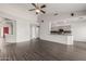 Open living area with a vaulted ceiling and bar that opens to the kitchen at 3348 E Sequoia Dr, Phoenix, AZ 85050