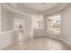 Bright living area featuring tiled floors, tray ceilings, and ample natural light at 3348 E Sequoia Dr, Phoenix, AZ 85050