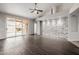 Large living room featuring wood flooring, vaulted ceilings, and a sliding glass door to backyard at 3348 E Sequoia Dr, Phoenix, AZ 85050