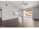 Spacious living room with wood floors, vaulted ceiling, and sliding glass door at 3348 E Sequoia Dr, Phoenix, AZ 85050