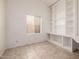 Bright office space with built-in shelving and a window, perfect for working from home at 3348 E Sequoia Dr, Phoenix, AZ 85050