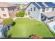 Backyard view featuring green turf and desert landscaping at 41581 W Somerset Dr, Maricopa, AZ 85138