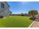 Artificial grass in backyard at 41581 W Somerset Dr, Maricopa, AZ 85138