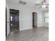 Bedroom with neutral walls, ceiling fan, closet and en-suite bathroom entrances at 41581 W Somerset Dr, Maricopa, AZ 85138