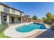 Inviting pool with waterfall feature is perfect for outdoor relaxation and enjoyment at 41581 W Somerset Dr, Maricopa, AZ 85138