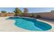 Backyard pool with spa and surrounding landscaping at 41581 W Somerset Dr, Maricopa, AZ 85138