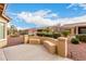 Spacious backyard with built-in seating, ideal for outdoor gatherings and enjoying the beautiful surroundings at 42911 W Magic Moment Dr, Maricopa, AZ 85138