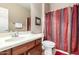 Bathroom featuring a vanity and framed mirror, toilet, and bathtub with a shower curtain at 42911 W Magic Moment Dr, Maricopa, AZ 85138