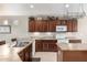 Well-equipped kitchen featuring modern appliances and a functional kitchen island at 42911 W Magic Moment Dr, Maricopa, AZ 85138