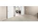 Neutral-toned living room with an open doorway, plush furniture, and a ceiling fan for comfort at 42911 W Magic Moment Dr, Maricopa, AZ 85138