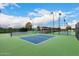 Well-maintained pickleball courts with ample lighting, perfect for friendly matches and recreational activities at 42911 W Magic Moment Dr, Maricopa, AZ 85138