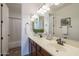 Bright bathroom showcasing a double sink vanity with white countertops and a separate shower and toilet room at 4576 E Waterman St, Gilbert, AZ 85297