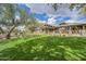 Community clubhouse with large covered patio and lush green grass on a sunny day at 4576 E Waterman St, Gilbert, AZ 85297