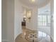 Elegant foyer with decorative tile and view to bathroom and living room with plantation shutters at 4576 E Waterman St, Gilbert, AZ 85297