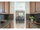Hallway with granite counters, dark wood cabinets, and views to a dining space at 4576 E Waterman St, Gilbert, AZ 85297