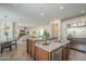 Open concept kitchen with granite counters, stainless steel appliances, and views to living space at 4576 E Waterman St, Gilbert, AZ 85297
