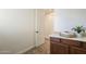 Laundry room with built-in counter, providing a clean space for organizing and folding clothes at 4576 E Waterman St, Gilbert, AZ 85297